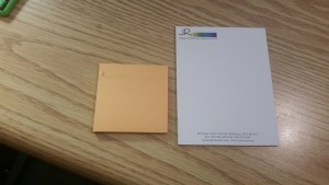 To the left you have a 3" square sticky notepads and on the right, you have a custom printed 4.5" x 5.75" notepad with loose sheets ready for you to tear away for everyday use